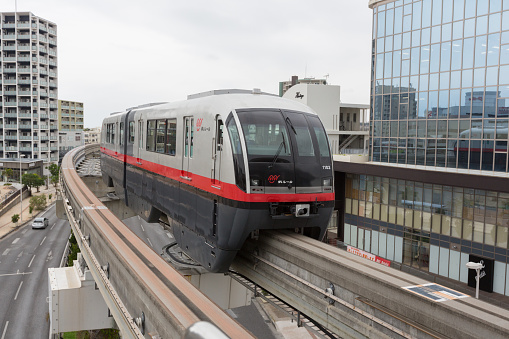 Naha, Japan - January 28, 2015 : Okinawa Monorail move past the Omoromachi Station in Naha, Okinawa, Japan. It is the only public rail system in Okinawa Prefecture.