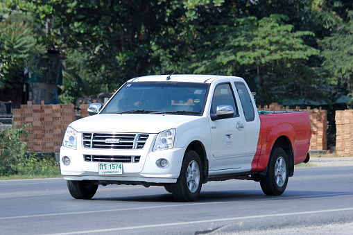  Chiangmai, Thailand -December  9, 2014:   Pick up truck of Thailand Post. Photo at road no.121 about 8 km from downtown Chiangmai, thailand.