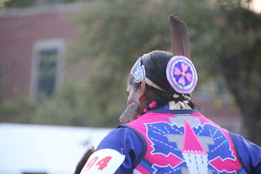 Glen Oaks, NY, USA - July 26, 2014: A Native American female at annual pow-wow at Queens County Farm Museum.