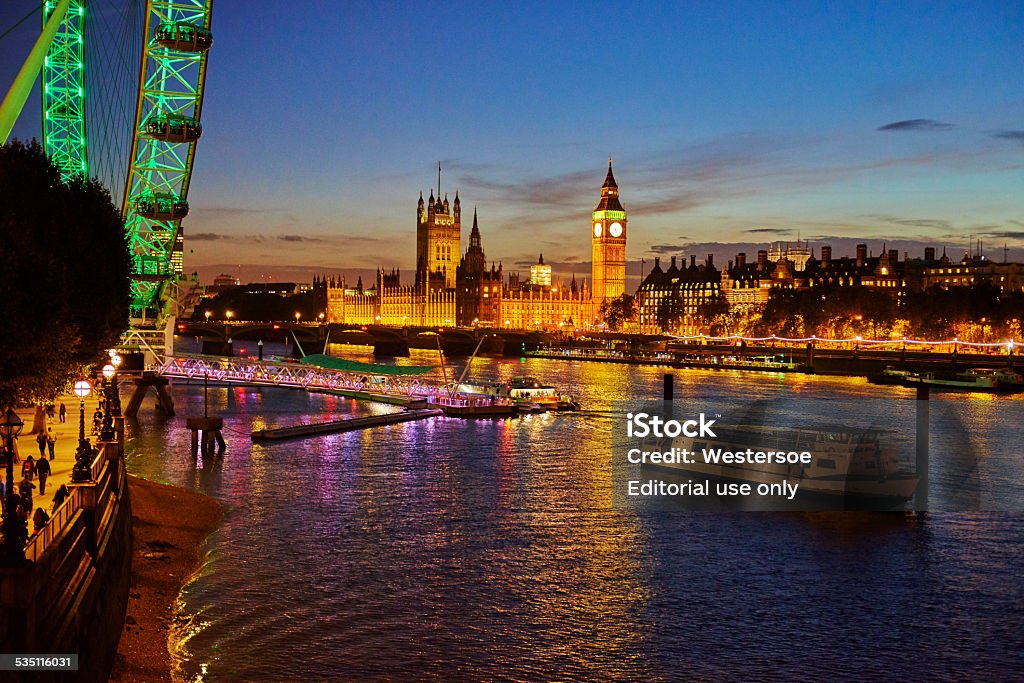 View towards big ben and the parliament London, United Kingdom - October 30, 2013: Scenery from The Thames with view of central part of the city right after sunset when the illumination takes over and changes the scenery. 2015 Stock Photo