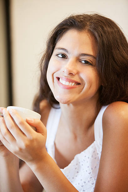 istock Beautiful Latin Woman Smiling Drinking Coffee 535116847