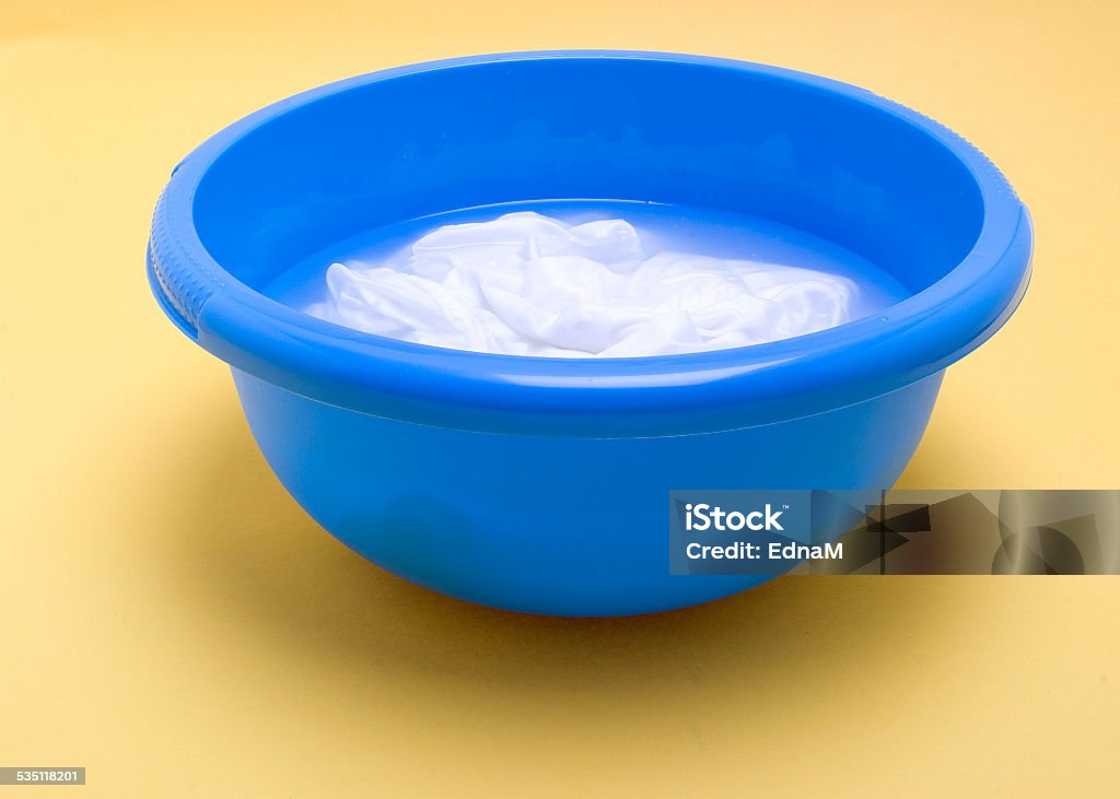 Laundry for bleaching in a plastic bowl 2015 Stock Photo