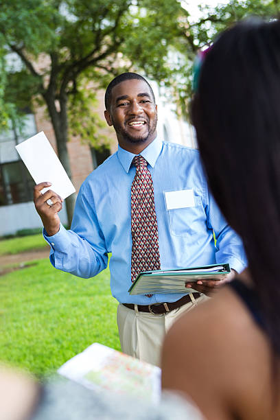 istock Professional campus guide leading tour of prospective students 535119187