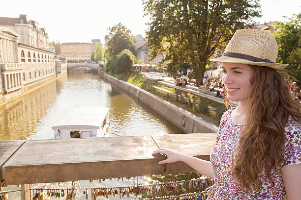 istock Girl on the bridge with symbolic padlocks 535162351