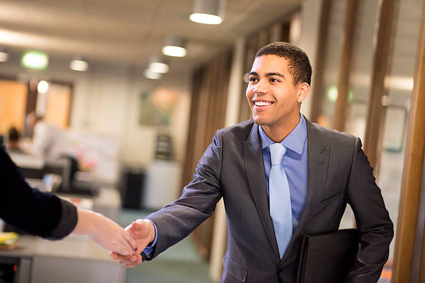 istock young man shakes hands with his potential new boss 535162465