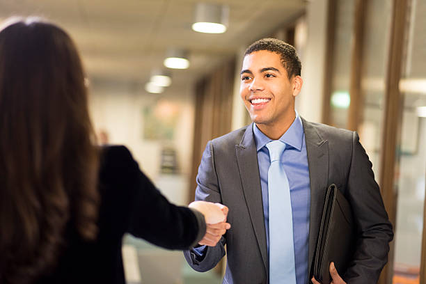 istock young man shakes hands with his potential new boss 535162473