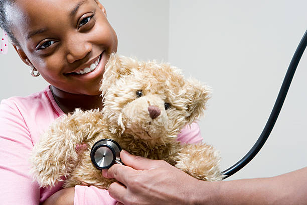 istock Girl and teddy with stethoscope 535162623