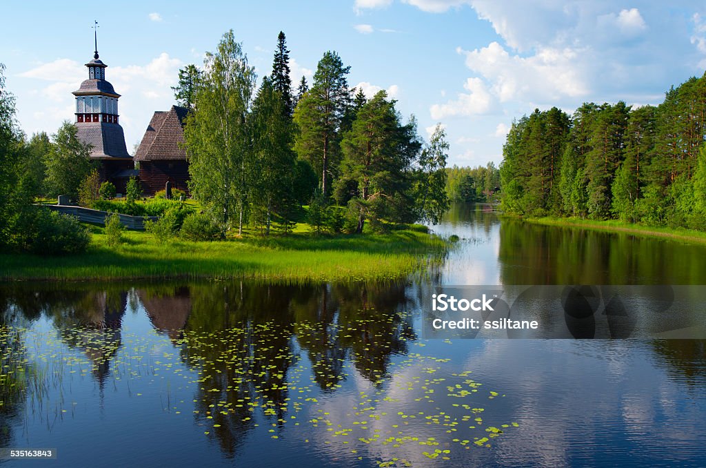 Old Wooden Church in Petajavesi, Finland Petajavesi Old Church, built in 1765, is a masterpiece of wood architecture. It is located in Petajavesi in Central Finland, and it was marked as a UNESCO World Heritage site in 1994. Here the church is seen over a lake in summertime. 2015 Stock Photo