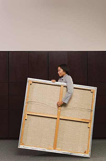 istock Business woman carrying canvas 535164519