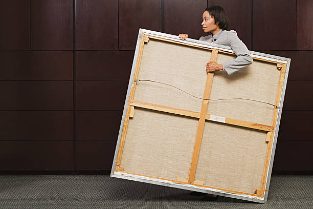 Business woman carrying canvas
