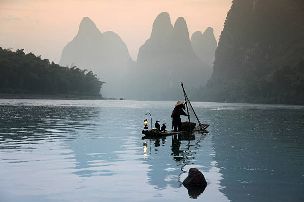 istock Fishing with cormorants birds in Yangshuo 535165039