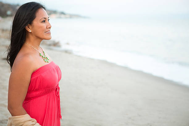 istock Asian woman at the beach 535165615
