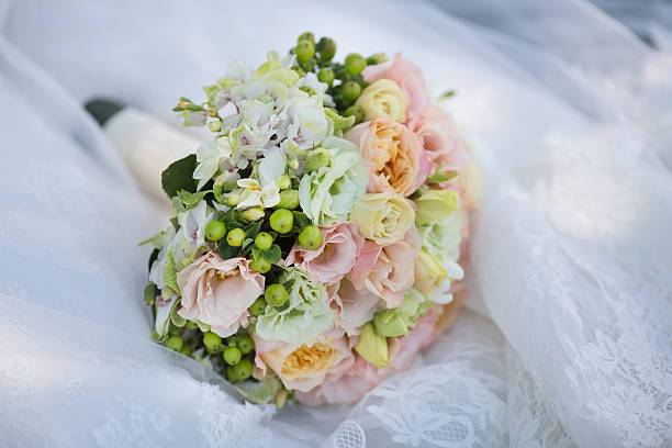 istock Wedding Bouquet on Bride's Dress 535165749