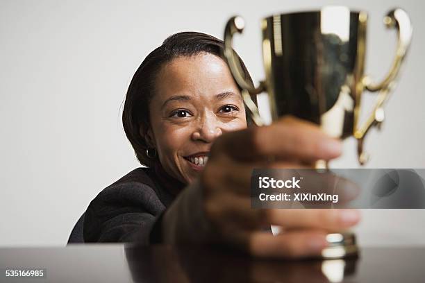 Business Woman Admiring Her Trophy Stock Photo - Download Image Now - Award, Business, One Woman Only