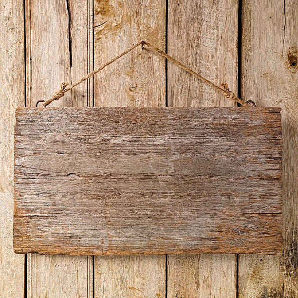 istock Old weathered wood signboard background. 535167579