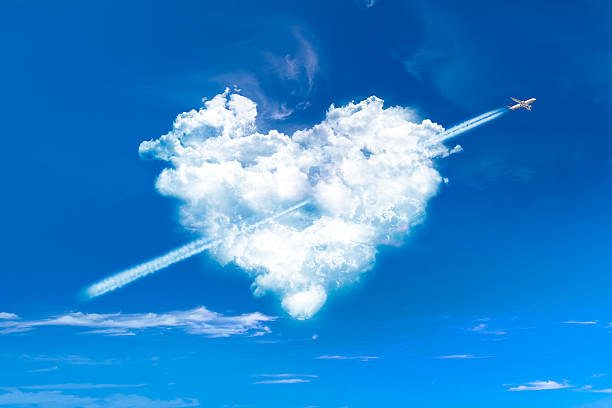 Love figurative heart from a white smoke trail airplane