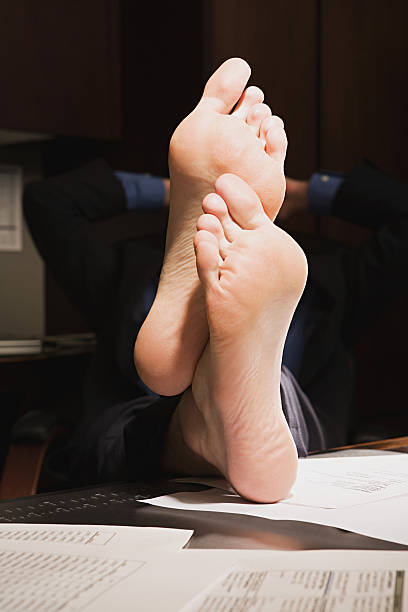 istock Businessman with feet up on desk 535170577