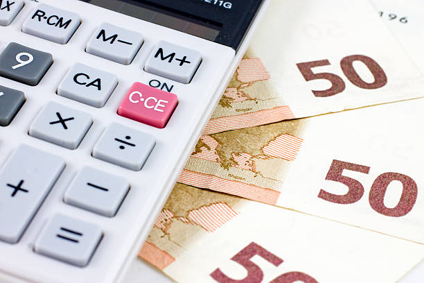 istock fifty euro bills and a calculator 535171283