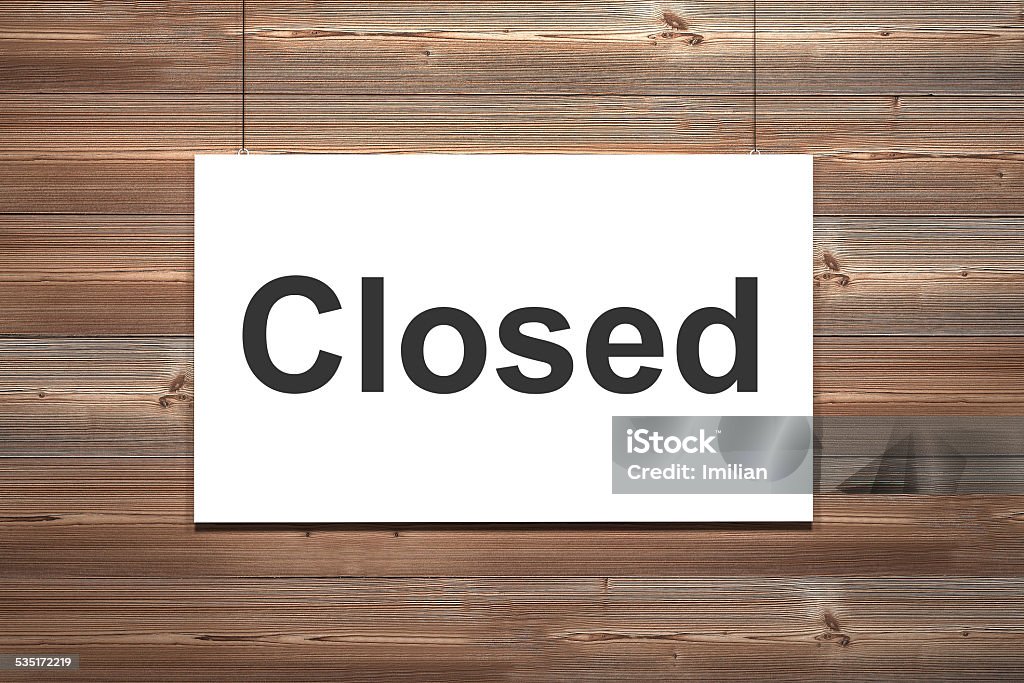 canvas hanging on wooden wall closed white canvas hanging on wooden wall closed Closing Stock Photo