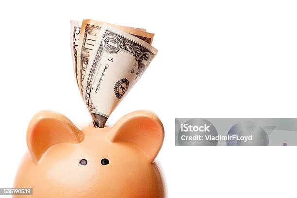 Close Up Of Piggy Bank And Money Put Into It Stock Photo - Download Image Now - 2015, Bank Deposit Slip, Banking