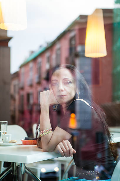 istock Woman Sitting at Cafe Table, Italy 535192013