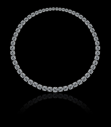 A magnificent necklace made by round diamonds on a black background with reflection