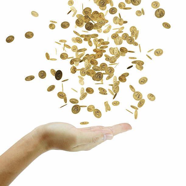 istock Coins falling down to the business's hand 535193487