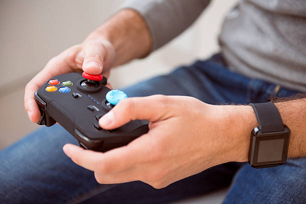 istock Man holding joystick of game console 535196202
