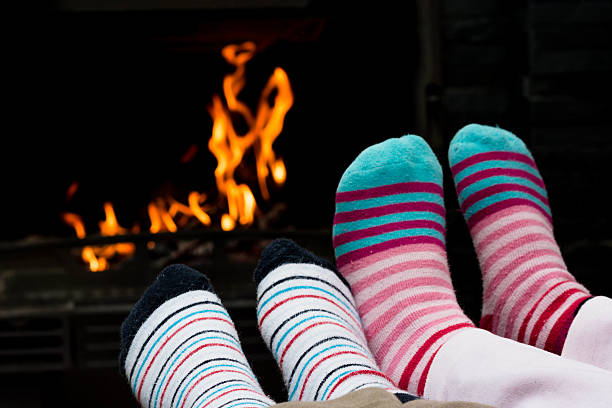 istock Two Child sitting by the Fireplace 535196235