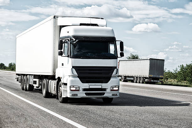 istock White truck on road. Cargo transportation 535197105
