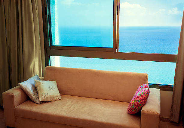 istock Sofa at the window with great marine view 535197251