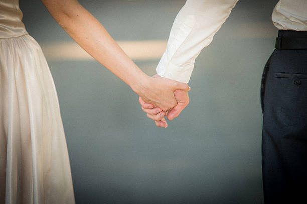 istock Young married couple holding hands 535198203