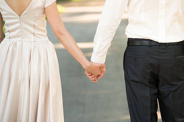 istock Young married couple holding hands 535198205