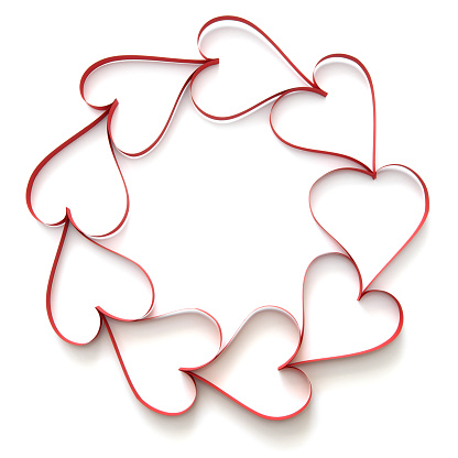 Heart shapes printed red and white ribbons over white background. Horizontal composition with clipping path and copy space. Valentine's Day concept.