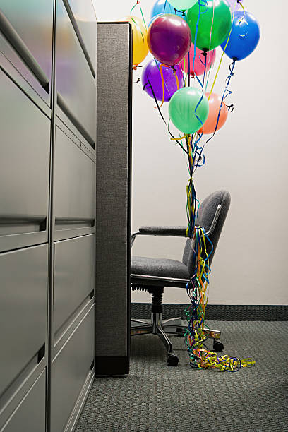 istock Empty office chair with balloons tied to it 535201001