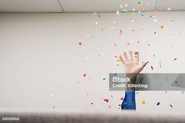 Businessman Throwing Confetti In The Air Stock Photo - Download Image Now - Celebration, Office, Confetti