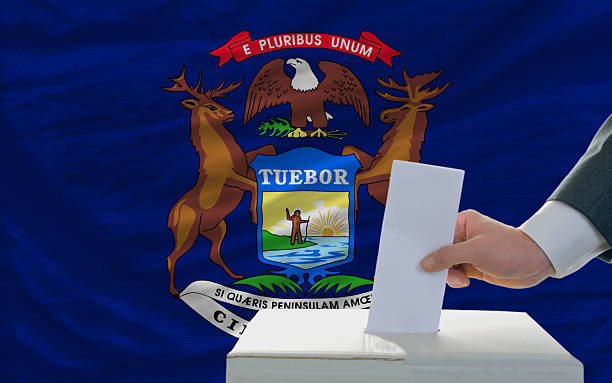 istock elections voting in front of flag of michigan 535201419