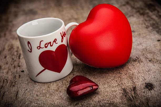 istock Red heart and mug on wooden background. Valentines day background 535201639
