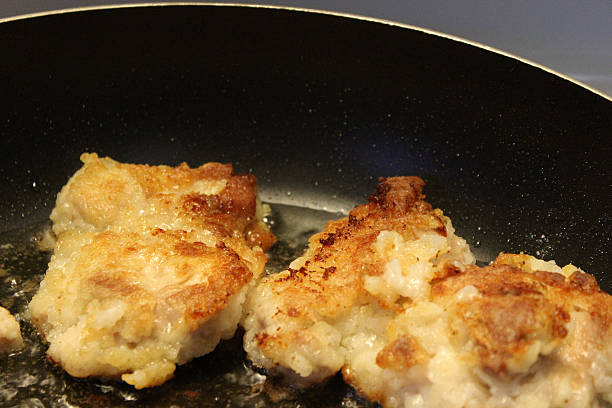 istock Chicken Thighs Frying in Pan 535218669