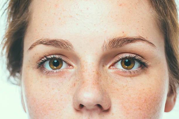 istock Woman  eyes studio beauty portrait freckles 535219599