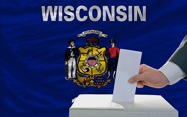 elections voting in front of flag of wisconsin stock photo