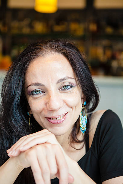 istock Woman Sitting at Cafe Table, Italy 535220555