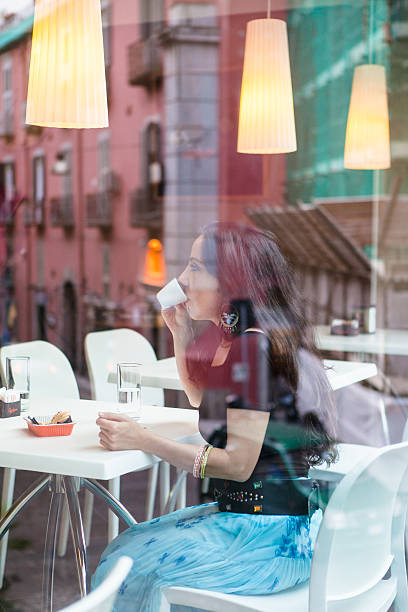 istock Woman Sitting at Cafe Table, Italy 535220563