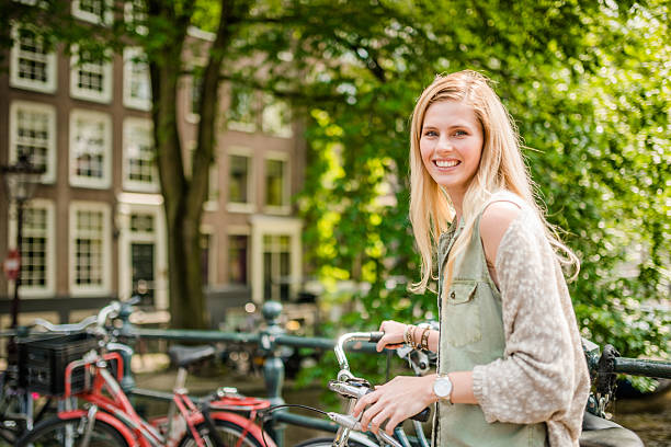 istock Dutch woman with bicycle in amsterdam 535220659