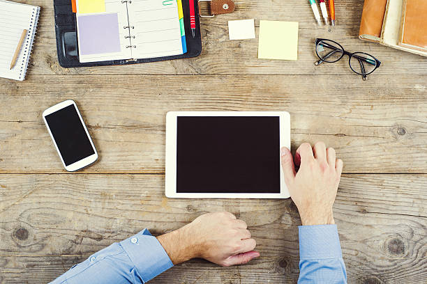 istock Desktop mix on a wooden office table. 535220959