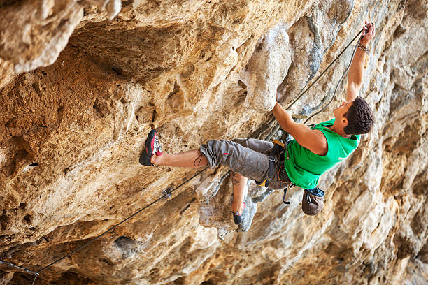 istock Rock climber on a face of a cliff 535221083