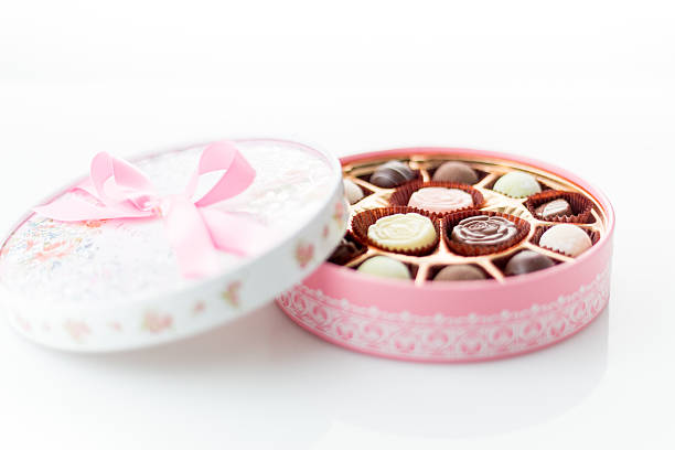 istock Chocolates in pink box on white background 535221629