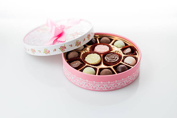 istock Chocolates in pink box on white background 535221633