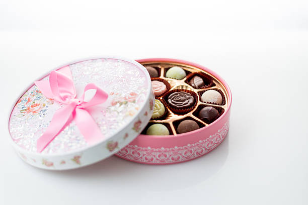 istock Chocolates in pink box on white background 535221635
