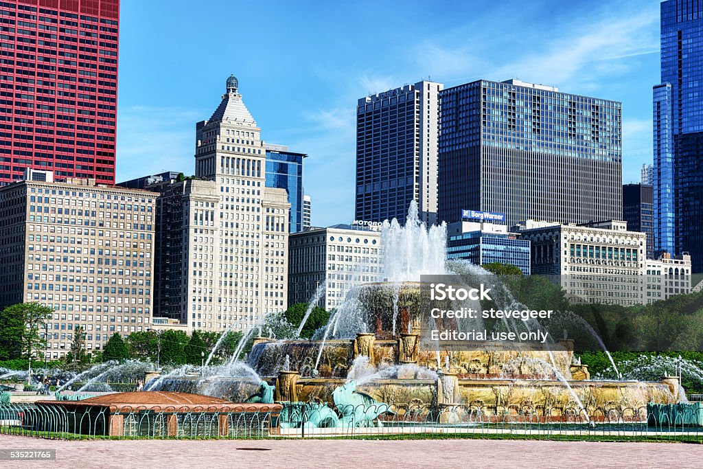 Fountain in Grant Park, Chicago Chicago, USA - May 31, 2014: Buckingham Fountain in Grant Park, The Loop, downtown Chicago.  Dedicated in 1927. Chicago skyline in the background. Distant people in background. 2015 Stock Photo